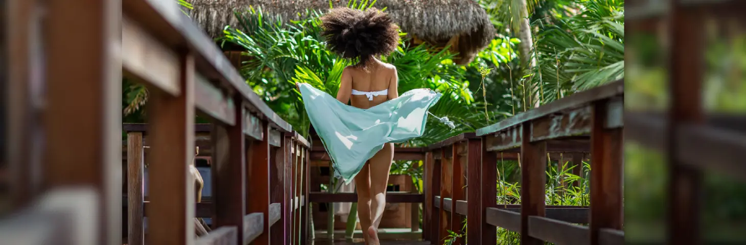 Image of a lady at a Sandals resort. 