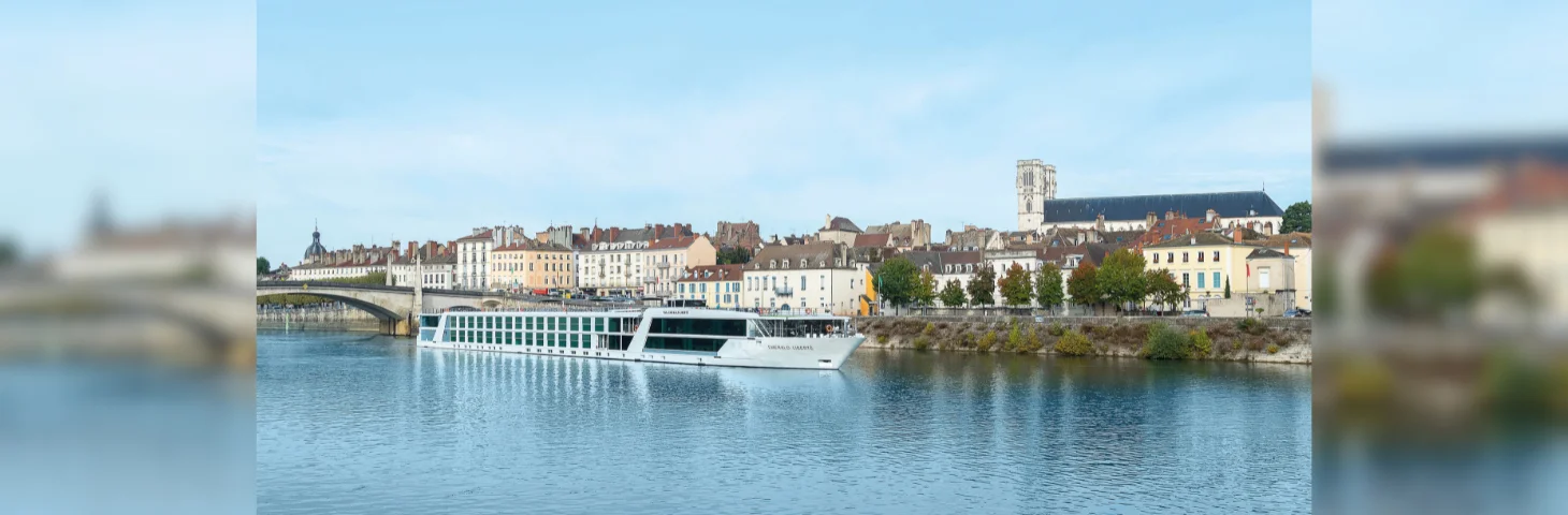 Emerald Liberte docked in a river.