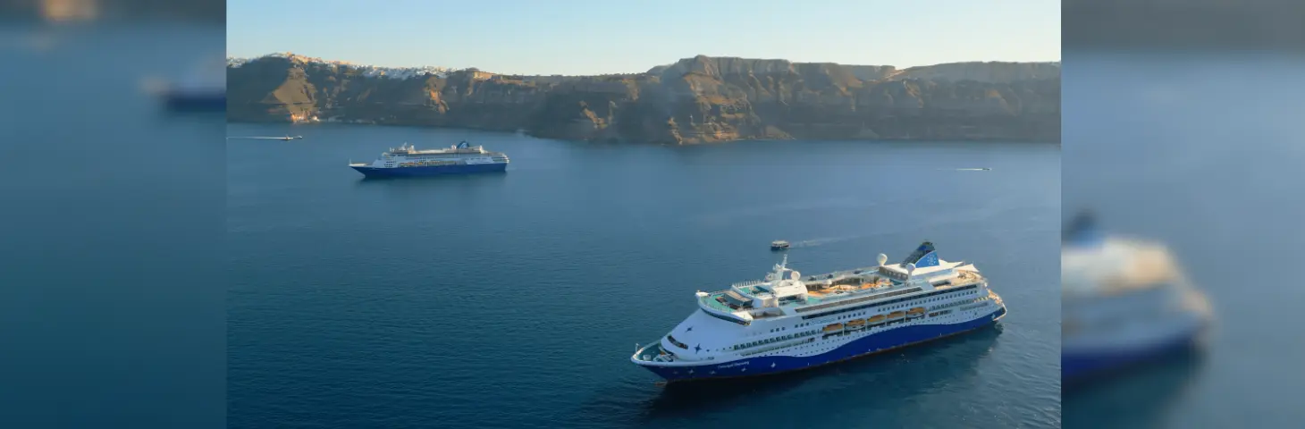 Image of Celestyal ships in Santorini bay. 