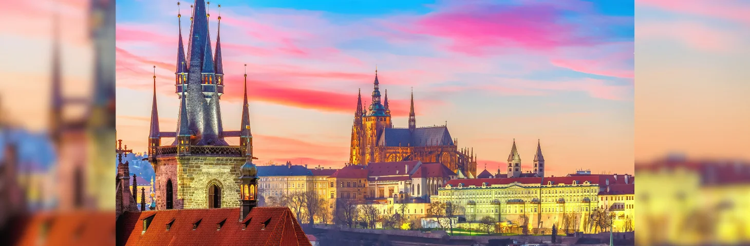 An aerial view of Prague Castle at sunset.