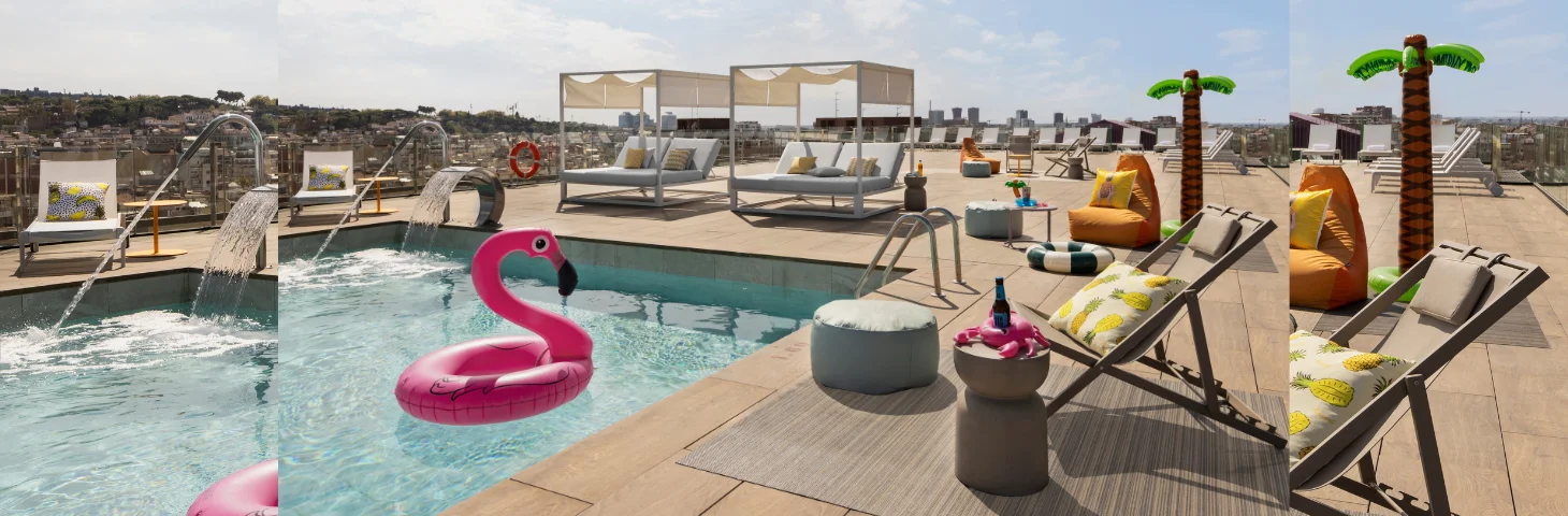 The rooftop pool at Moxy Barcelona, with an inflatable flamingo in the pool and palm trees around the seating area.